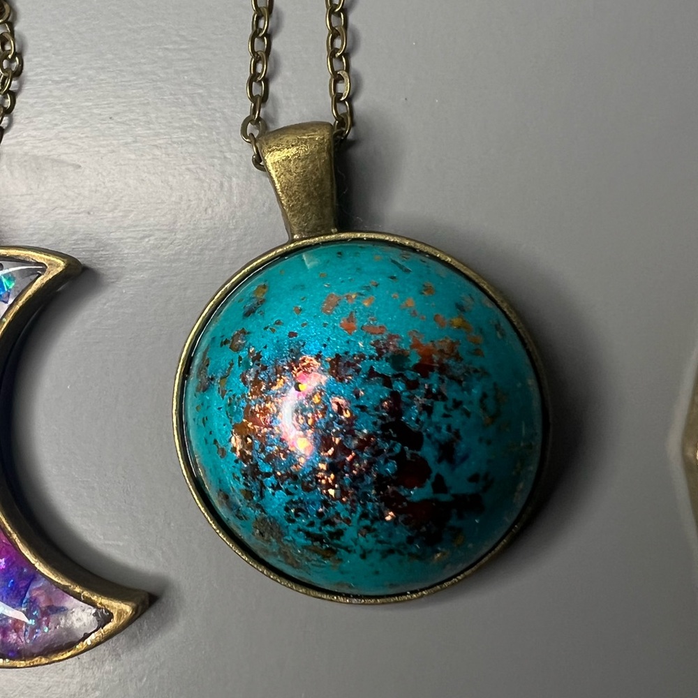 Handmade turquoise colored epoxy with copper flecks.